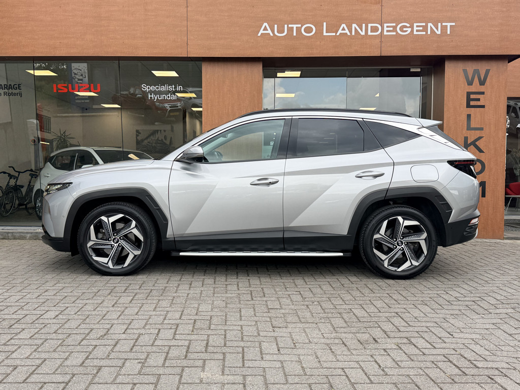 Hyundai Tucson 1.6 T-GDI HEV Premium Sky | Trekhaak | 1650 kg trekgewicht | Panoramadak | Full options 53954652-0.jpg | Auto Landegent